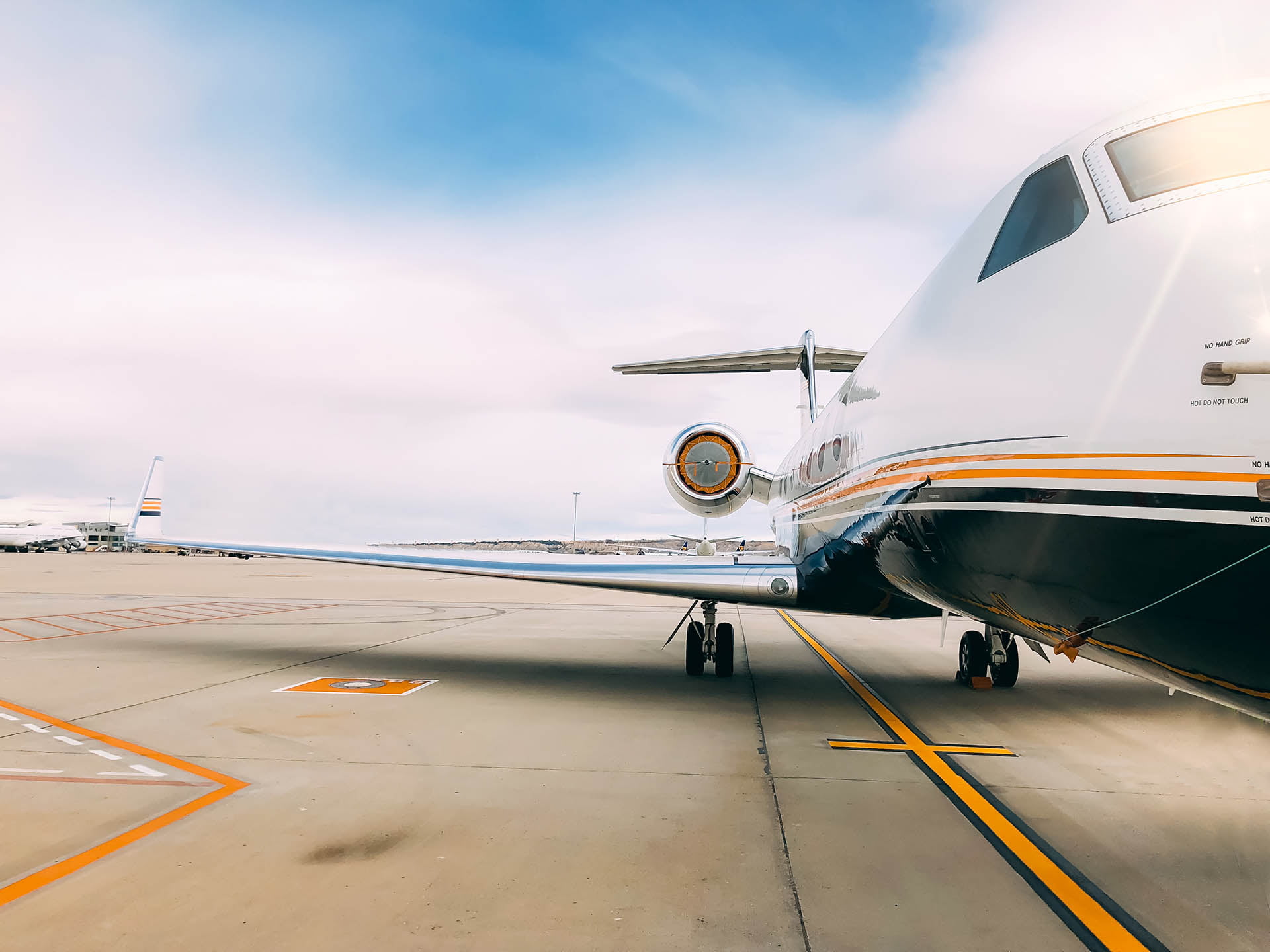 Private luxury jet at the airport terminal runway